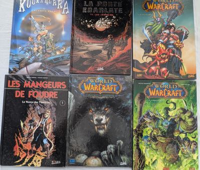 Six livres consacrés à World of Warcraft sont alignés sur une table