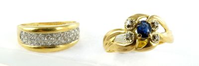 pair of diamond and sapphire earrings on display in a display case