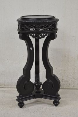 a black table with a black top and a black base