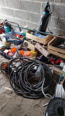 a pile of wires and other electrical equipment on the ground