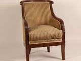 a brown and white striped chair with a wooden frame