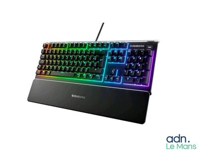 a computer keyboard that is sitting on top of a table