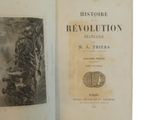 an old book with a black and white photo of a man on a horse