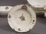 a lot of plates that are sitting on a table