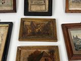 many framed pictures hanging on the wall of a room