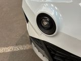 a close up of a car ' s front bumper with a camera attached to it