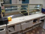 a counter with a counter top and a counter top with a printer on it