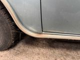 a close up of a car tire with mud on it