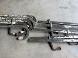 two wrenches are laying on the floor next to each other