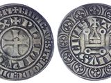 une pièce de monnaie en argent portant l'image d'une croix