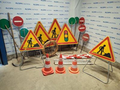 many road signs and cones in a room