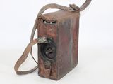 an old camera that is sitting on a white surface