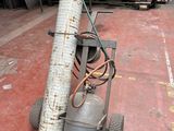 a propanene on a cart in a warehouse