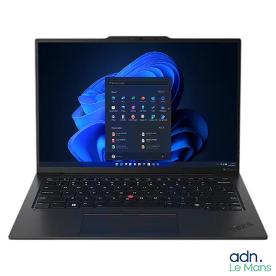 the laptop is open on a white surface with a blue background