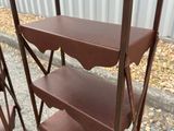 a shelf with three shelves on it in the street