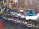 a workbench with many tools on it in a garage