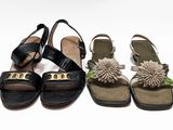 three pairs of sandals with pom poms on them sitting next to each other