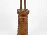 an old wooden bell with a wooden handle on a white background