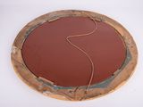 a picture of a circular mirror with a cord in it