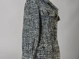a black and white coat on a mannequin mannequin mannequin mannequin mannequin mannequin mannequin mannequin mann