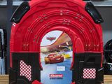 a red and black suitcase with a picture of cars on it