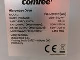 a close up of a microwave oven with a label on it