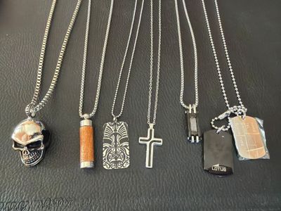 many different types of necklaces on a table