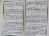 an open book with a black and white image of a man ' s hand holding a book