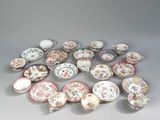 many different types of plates and bowls on the table