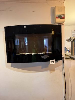 a television mounted on the wall in a kitchen