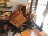 a table with chairs and a table with a wine glass on it