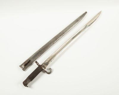 two old swords on a white surface with a white background
