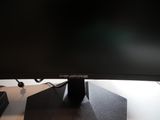 a computer monitor sitting on top of a desk