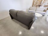 a couch and a table in a room with a wall