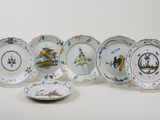 several plates with different designs and designs on them on a white surface