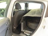 a car that has a suitcase in the back of it