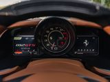 the dashboard of a sports car with a speedometer, gauges, and a steering wheel