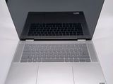 an open laptop computer sitting on top of a white table