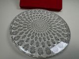 a glass plate with a red box on the table
