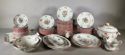 many different types of dishes and cups on the table