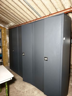 a room that has a bunch of metal cabinets in it