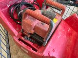 a red box with a red handle and some wires in it