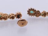 a pair of gold and turquoise stone earrings