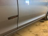 a car with a sticker on the side of it ' s door