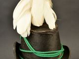 a black hat with a feather on top of it