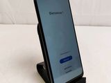 the back of a black samsung s9 phone with a blue screen