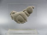 a sculpture of a teddy bear in a clear display case