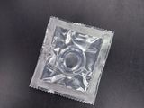 a condom that is sitting on a black table
