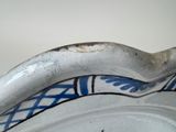 a close up of a plate with a banana on it
