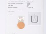 a piece of paper with a picture of a medal on it